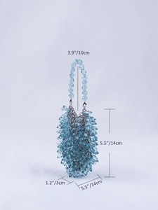 Close-up of light blue crystal teardrop beads and fringe detail on handmade handbag