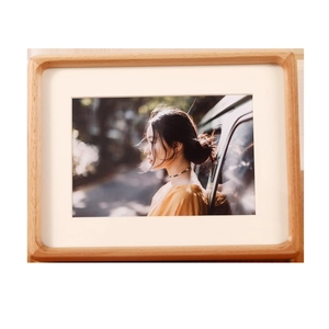 Minimalist solid wood picture frame with rounded corners and natural wood grain finish
