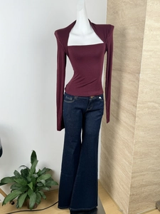 Detail of slim fit dark blue flare jeans and long sleeve square neck top set