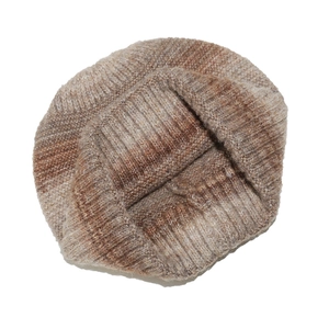 Close-up detail of earthy tie-dye gradient knit beanie with soft rib-knit wool texture