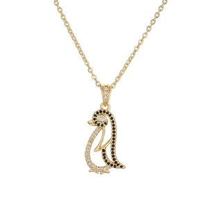Chic penguin pendant necklace in gold finish with sparkling black and white crystals