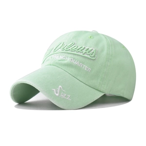 Detail of the New Orleans 3D embroidery and vintage washed cotton on a mint green cap
