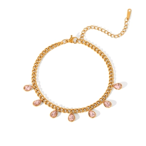 Detail of gold Cuban chain bracelet featuring pink teardrop zircon pendants and lobster clasp