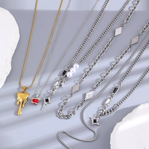 Collection of gothic heart and cross pendant necklaces with pearl accents and metal chains