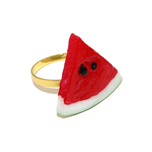 Close-up of watermelon napkin ring with red pulp and green rind on a gold band