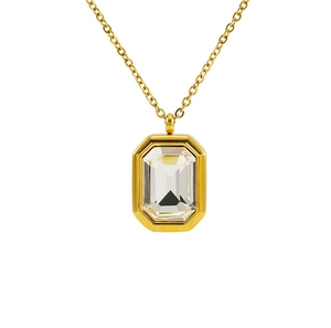 Detailed close-up of emerald cut clear crystal pendant on a golden stainless steel chain