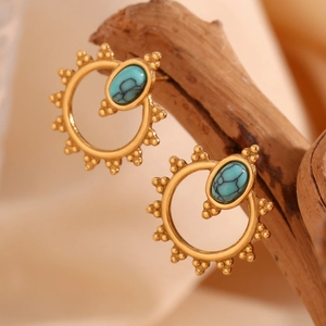 Bohemian gold plated sun-shaped earrings featuring blue turquoise stone on wood branch