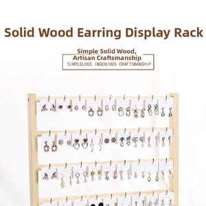 Detailed view of the 4-tier solid wood earring display stand with natural grain finish