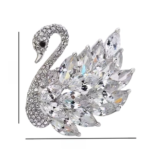 Detailed view of silver swan brooch with crystals and measurements of 4.2cm by 4.8cm