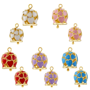 Macro shot of colorful enamel heart bell pendants for DIY jewelry making in various hues