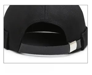 Detail of adjustable black leather strap and silver buckle on brimless docker hat
