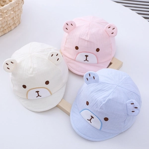 Newborn baby caps with bear ears in white, pink and blue colors with cotton texture