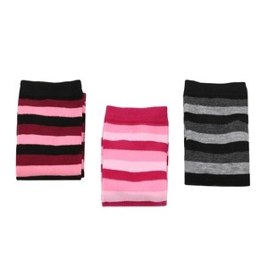 Three pairs of striped calf-high knitted leg warmers in various colors for cozy winter wear