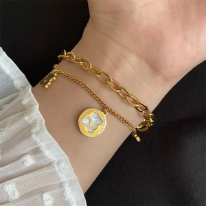 Double-layered golden bear bracelet featuring white mother-of-pearl inlay on chain