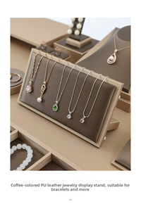 Detail view of coffee-colored PU leather jewelry display stand with brushed texture