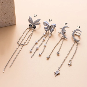 Silver fringe butterfly ear clips set with cubic zirconia and moon star tassel design