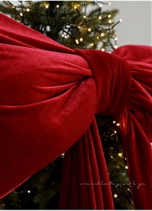 Detail of high-quality red velvet bow with neat stitching for Christmas tree decoration