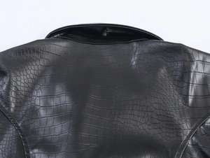 Detail of the black faux leather trench coat showing crocodile embossed texture on the back