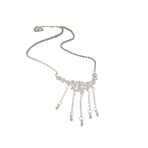 Elegant silver flower necklace featuring fringe chains and teardrop pendants on white base