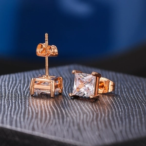 Macro shot of rose gold square cubic zirconia stud earrings with four-prong setting