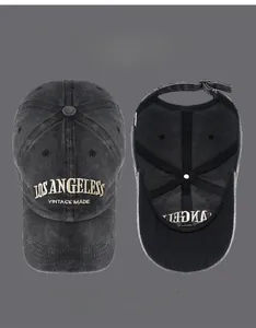 Detail view of the vintage washed baseball cap featuring Los Angeles 3D embroidery and metal buckle