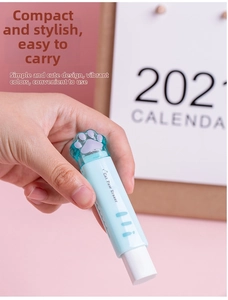 Detail of light blue cat paw eraser showing the push-pull mechanism and cute purple tip