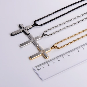 Polished stainless steel cross necklaces in black, silver, and gold with rhinestone inlay