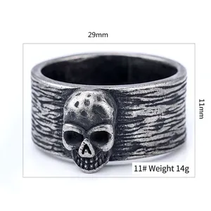 Vintage oxidized skull ring with textured bark pattern band in retro biker style