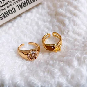 Elegant gold-plated adjustable ring with oval tiger eye stone and zircon accents