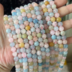 Macro detail of natural Morganite beryl beads in soft pastel Morandi color shades