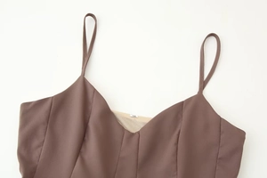 Detail shot of a brown camisole top showing the smooth texture and size M label