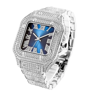 Macro detail of luxury silver iced-out square watch with blue dial and Roman numerals