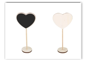 Macro view of heart-shaped mini wooden chalkboard signs for weddings and party decor