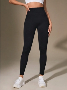 Detail of high-waist seamless yoga leggings showing breathable fabric and compression fit