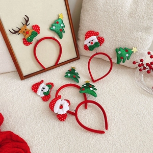 Detail of Christmas headbands featuring sequined Santa Claus, trees and reindeer antlers