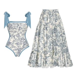 Blue and white floral one-piece swimsuit with high-waisted umbrella skirt beach set
