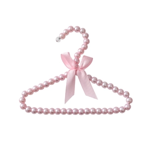 Pink faux pearl pet clothes hanger with a cute ribbon bow for puppies and kittens
