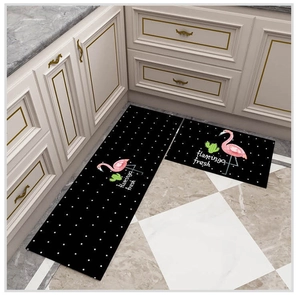 Waterproof kitchen mat set featuring pink flamingos and green cacti on black surface