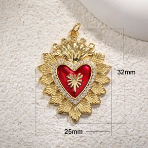 Detail view of 32x25mm red enamel heart crown pendant with gold plating and crystals