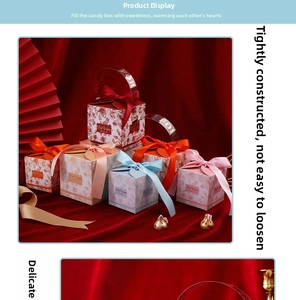 Close-up of elegant square gift box with floral pattern, ribbon bow and gold foil accents