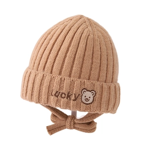 Warm winter baby knit hat with bear embroidery and ear flaps in light khaki color