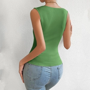 Close-up of green ribbed knit tank top fabric and texture on model back view