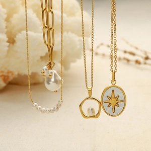 Elegant 18k gold plated pearl necklace set featuring baroque pearls and star pendants