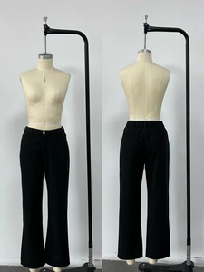 Detail view of high waist black straight leg jeans showing front and back fit on mannequin