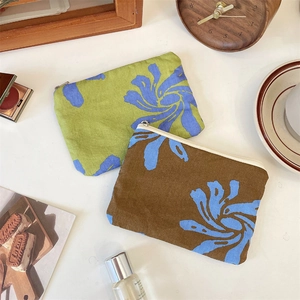 Flat lay of green and brown floral fabric pouches for small items and makeup organization