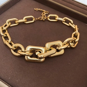 Detailed macro view of the gold chain necklace with lobster clasp in a jewelry box