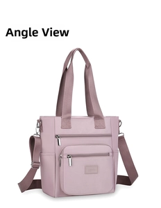 Detail of lilac oxford nylon crossbody bag with dual handles and multiple zipper pockets