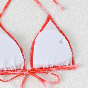 Detail of bikini top interior showing breathable mesh lining and removable padding inserts