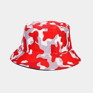 Macro detail of camouflage bucket hat showing red and grey fabric patterns and stitching
