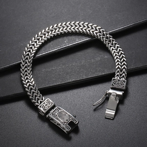 Men's hip hop double-row stainless steel woven chain bracelet on black background